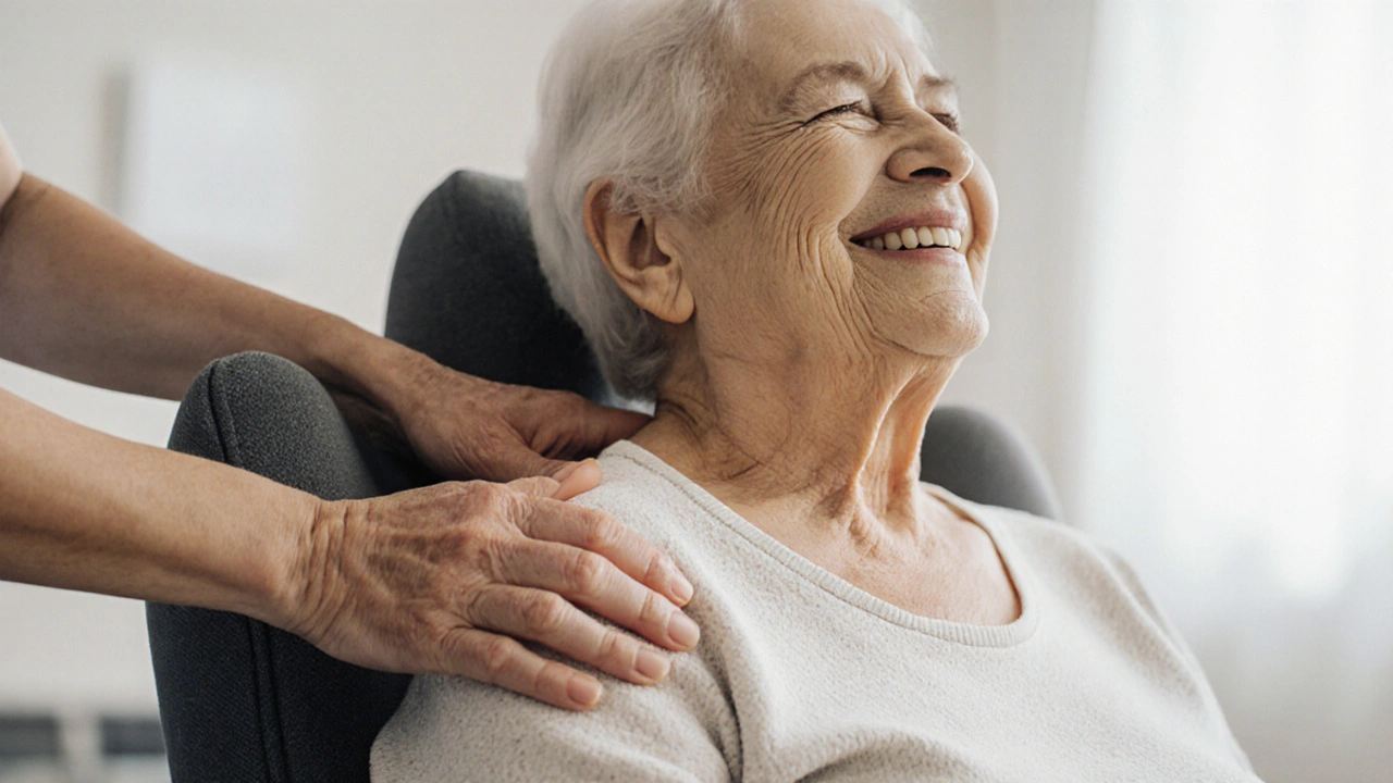 An elderly woman sitting calmly in a chair, hand on her back, showing quiet relief during a session.